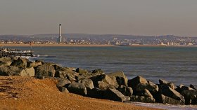 Lancing Beach - Looking east towards Shoreham Power Station and Hove, with rock sea defences on the beach. (© © Copyright Ian Capper (http://www.geograph.org.uk/profile/16999) and licensed for reuse (http://www.geograph.org.uk/reuse.php?id=1091924) under this Creative Commons Licence (https://creativecommons.org/licenses/by-sa/2.0/))