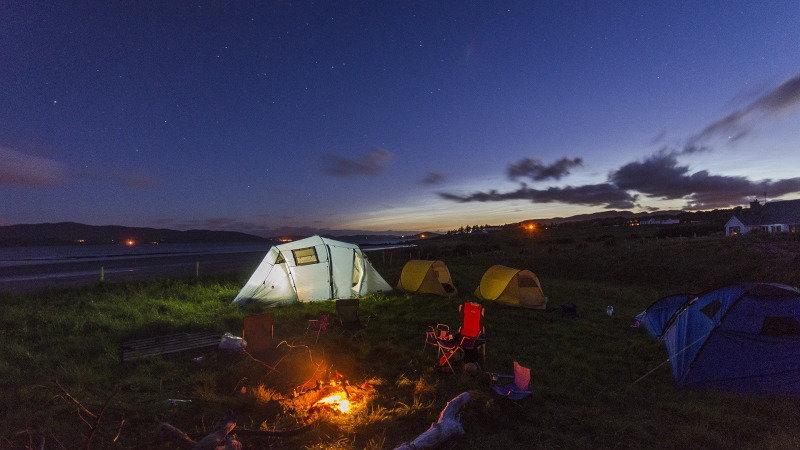 A campsite at night - Books on camping