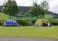 bue & green tent & hills