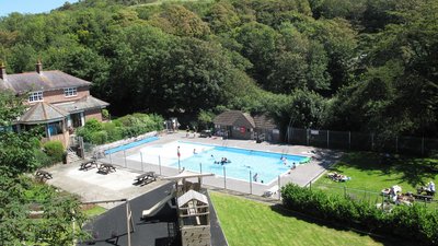 The heated outdoor pool and play area
