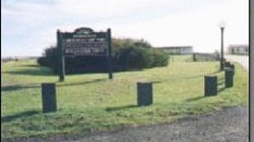 Entrance to the caravan park with a sign