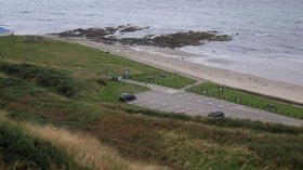Banff Links carpark and 'The Tumblers' near the caravan site (© © Copyright Stanley Howe (http://www.geograph.org.uk/profile/7629) and licensed for reuse (http://www.geograph.org.uk/reuse.php?id=3127420) under this Creative Commons Licence (https://creativecommons.org/licenses/by-sa/2.0/).)