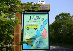 The Meadows Sign - A picture of the entry sign to The Meadows Campsite on a nice sunny day