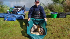Happy angler with a bag of mixed fish (© Broom Leisure Ltd)