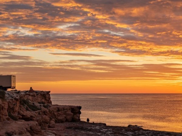 Camper van at sunset - Parked on a clifftop